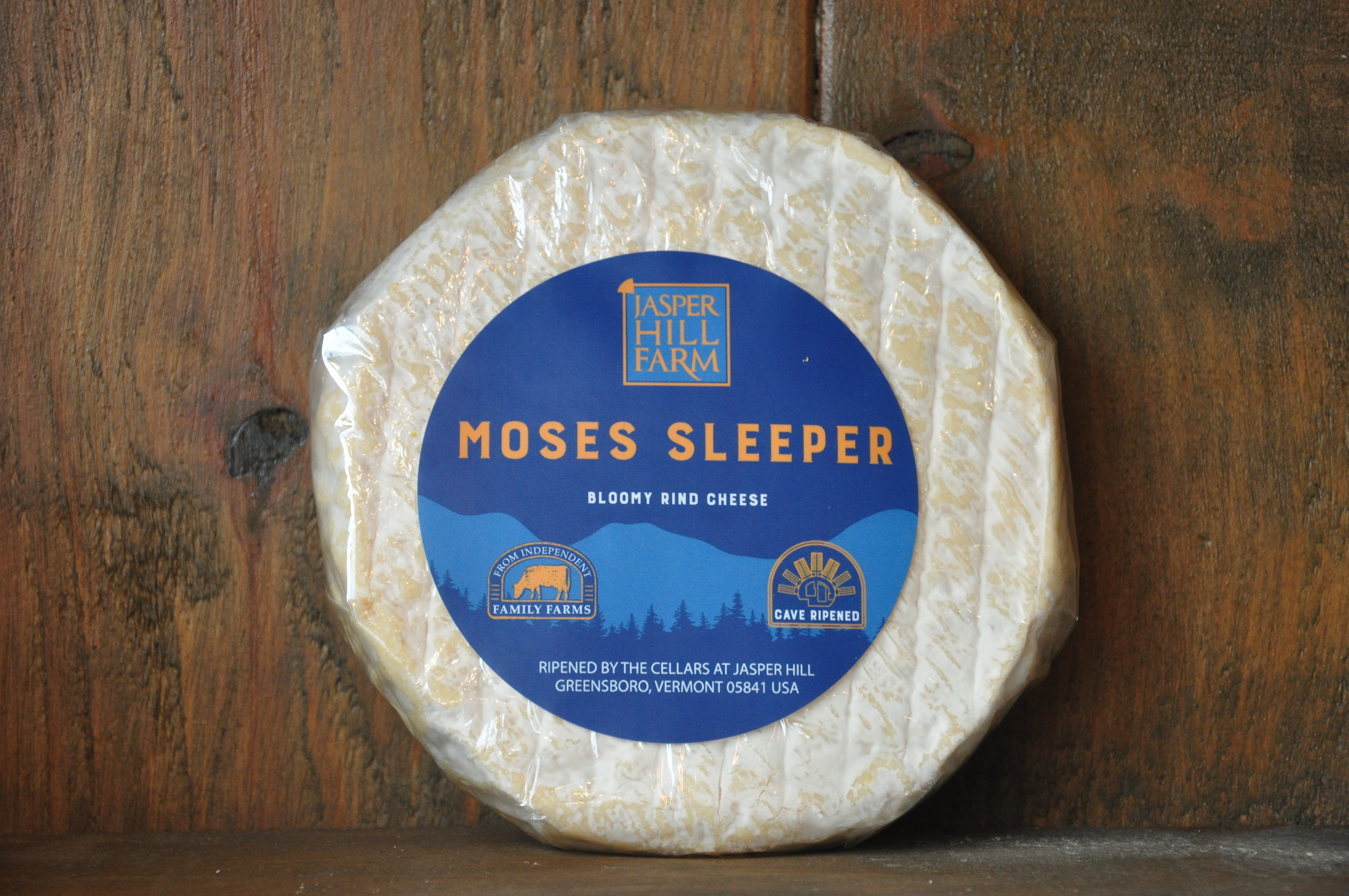 Round of Moses Sleeper brie-style cheese with bloomy white rind